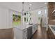 Bright kitchen with a center island, stainless steel appliances, and hardwood flooring at 4445 Beechnut Circle, Cumming, GA 30028