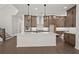 Modern kitchen with a large island, stainless steel appliances, and ample cabinet space at 4445 Beechnut Circle, Cumming, GA 30028