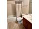 Cozy bathroom featuring a shower-tub combo with a tile surround and a single sink vanity at 1612 Huntingdon, Atlanta, GA 30350
