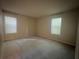 Spacious bedroom with neutral walls, carpet, and dual windows providing abundant natural light at 1612 Huntingdon, Atlanta, GA 30350