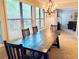 Light-filled dining room featuring a dark wood table and views to a living room and the outdoors at 1612 Huntingdon, Atlanta, GA 30350
