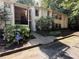 Apartment building featuring accessible entrance, landscaped with colorful hydrangeas and mature trees at 1612 Huntingdon, Atlanta, GA 30350