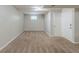 Finished basement space featuring neutral paint, carpet flooring, and a single window for natural light at 2242 Cherokee Valley Cir, Lithonia, GA 30058