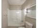 Clean bathroom featuring a shower-tub combo and a vanity with ample lighting at 2242 Cherokee Valley Cir, Lithonia, GA 30058
