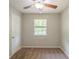 Bedroom features a ceiling fan and a window for natural light and ventilation at 2242 Cherokee Valley Cir, Lithonia, GA 30058