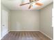 A comfy bedroom with a ceiling fan, window, and neutral-colored walls with plush carpet at 2242 Cherokee Valley Cir, Lithonia, GA 30058
