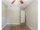 Comfortable bedroom with a ceiling fan, neutral carpet, and doorway to another room at 2242 Cherokee Valley Cir, Lithonia, GA 30058