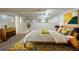 Bright basement bedroom with a large bed, statement rug, and modern decor at 2242 Cherokee Valley Cir, Lithonia, GA 30058