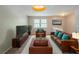 Comfortable living room showcasing a seating arrangement, plush carpet, and natural lighting at 2242 Cherokee Valley Cir, Lithonia, GA 30058