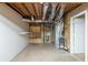 Unfinished basement with exposed pipes, utilities, and a partial wall at 2242 Cherokee Valley Cir, Lithonia, GA 30058