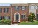 Charming brick townhome with a well-maintained front lawn and inviting entrance at 573 Hambrick Sq, Stone Mountain, GA 30083