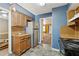 Practical kitchen with stainless steel refrigerator and laminate flooring at 573 Hambrick Sq, Stone Mountain, GA 30083