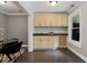 Charming bar area featuring custom cabinetry, granite countertops, and a convenient wine rack at 1292 Lenox Park Ne Blvd, Brookhaven, GA 30319