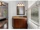 Bathroom featuring warm lighting and an adjacent view into the bedroom at 1292 Lenox Park Ne Blvd, Brookhaven, GA 30319