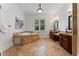 Large bathroom with a soaking tub, travertine tile, and separate vanities at 1292 Lenox Park Ne Blvd, Brookhaven, GA 30319