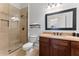 Modern bathroom with a glass-enclosed shower and a marble countertop at 1292 Lenox Park Ne Blvd, Brookhaven, GA 30319