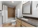 Well-appointed bathroom with vanity, granite counters, and a shower-tub combo, offering a refreshing experience at 1292 Lenox Park Ne Blvd, Brookhaven, GA 30319