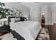 Comfortable bedroom with hardwood floors, a stylish bed, and neutral decor at 1292 Lenox Park Ne Blvd, Brookhaven, GA 30319