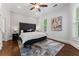 Serene bedroom showcasing hardwood floors and an upholstered headboard at 1292 Lenox Park Ne Blvd, Brookhaven, GA 30319