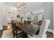 Bright dining room with modern lighting, neutral colored walls, and beautiful hardwood floors at 1292 Lenox Park Ne Blvd, Brookhaven, GA 30319