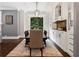 Elegant dining room featuring a table with seating for six and custom built-in cabinetry at 1292 Lenox Park Ne Blvd, Brookhaven, GA 30319