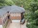 Brick house featuring an attached garage, landscaped grounds and an eye-catching slate roof at 1292 Lenox Park Ne Blvd, Brookhaven, GA 30319