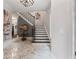 Elegant foyer with marble floors, a staircase, and stylish decor at 1292 Lenox Park Ne Blvd, Brookhaven, GA 30319