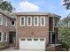 Charming brick home with a two-car garage and landscaped front yard at 1292 Lenox Park Ne Blvd, Brookhaven, GA 30319