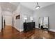 Hallway with hardwood floors, a dresser with lamps, and a view into the primary bedroom at 1292 Lenox Park Ne Blvd, Brookhaven, GA 30319