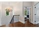 Bright hallway with a chandelier and hardwood floors leading to bedrooms at 1292 Lenox Park Ne Blvd, Brookhaven, GA 30319