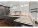 Open kitchen featuring custom cabinetry, modern appliances, and a large center island with counter seating at 1292 Lenox Park Ne Blvd, Brookhaven, GA 30319