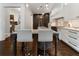 Gourmet kitchen showcasing a center island with counter seating and pendant lighting at 1292 Lenox Park Ne Blvd, Brookhaven, GA 30319