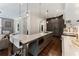 Contemporary kitchen with gray cabinetry, quartz countertops, and a center island with barstools at 1292 Lenox Park Ne Blvd, Brookhaven, GA 30319