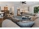 Open-concept living room flowing into dining area, featuring neutral decor, hardwood floors, and recessed lighting at 1292 Lenox Park Ne Blvd, Brookhaven, GA 30319