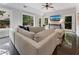 Bright living room featuring a large sectional sofa, floor to ceiling windows, and access to a patio at 1292 Lenox Park Ne Blvd, Brookhaven, GA 30319
