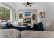 Open living room with a large sectional sofa, hardwood floors, and bright natural lighting at 1292 Lenox Park Ne Blvd, Brookhaven, GA 30319