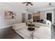 Spacious living room with wet bar, open concept design, hardwood floors, and neutral colored walls at 1292 Lenox Park Ne Blvd, Brookhaven, GA 30319