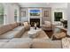 Comfortable living room with a fireplace, plush seating, and ample natural light at 1292 Lenox Park Ne Blvd, Brookhaven, GA 30319
