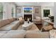 Inviting living room with a fireplace, gray walls, large windows, and comfortable seating at 1292 Lenox Park Ne Blvd, Brookhaven, GA 30319
