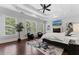 Bright and airy primary bedroom with a sitting area, fireplace and tray ceiling at 1292 Lenox Park Ne Blvd, Brookhaven, GA 30319
