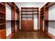 Spacious walk-in closet featuring custom wood shelving and drawers for maximum storage and organization at 1292 Lenox Park Ne Blvd, Brookhaven, GA 30319