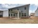 A lovely backyard featuring a covered patio and ample space for outdoor activities and entertaining at 251 Arnewood Cir, Mcdonough, GA 30253