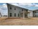 Rear elevation with backyard patio at 251 Arnewood Cir, Mcdonough, GA 30253