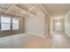 Neutral dining room featuring a coffered ceiling and modern light fixture over wood-look floors at 251 Arnewood Cir, Mcdonough, GA 30253
