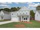 Charming two-story home with a manicured lawn and a welcoming front porch at 251 Arnewood Cir, Mcdonough, GA 30253