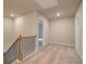 Upstairs hallway with neutral carpet and access to multiple rooms at 251 Arnewood Cir, Mcdonough, GA 30253