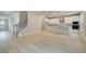 Open floor plan showcases kitchen and stairs with natural light at 251 Arnewood Cir, Mcdonough, GA 30253