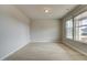 Bright living room with wood-look floors and large windows allowing plenty of natural light at 251 Arnewood Cir, Mcdonough, GA 30253