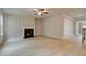 Living room featuring a fireplace, wood-look floors and neutral paint scheme at 251 Arnewood Cir, Mcdonough, GA 30253