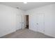 Bedroom with neutral carpeting and three doors for optimal flow and function at 362 Olmstead Way # 23, Alpharetta, GA 30022